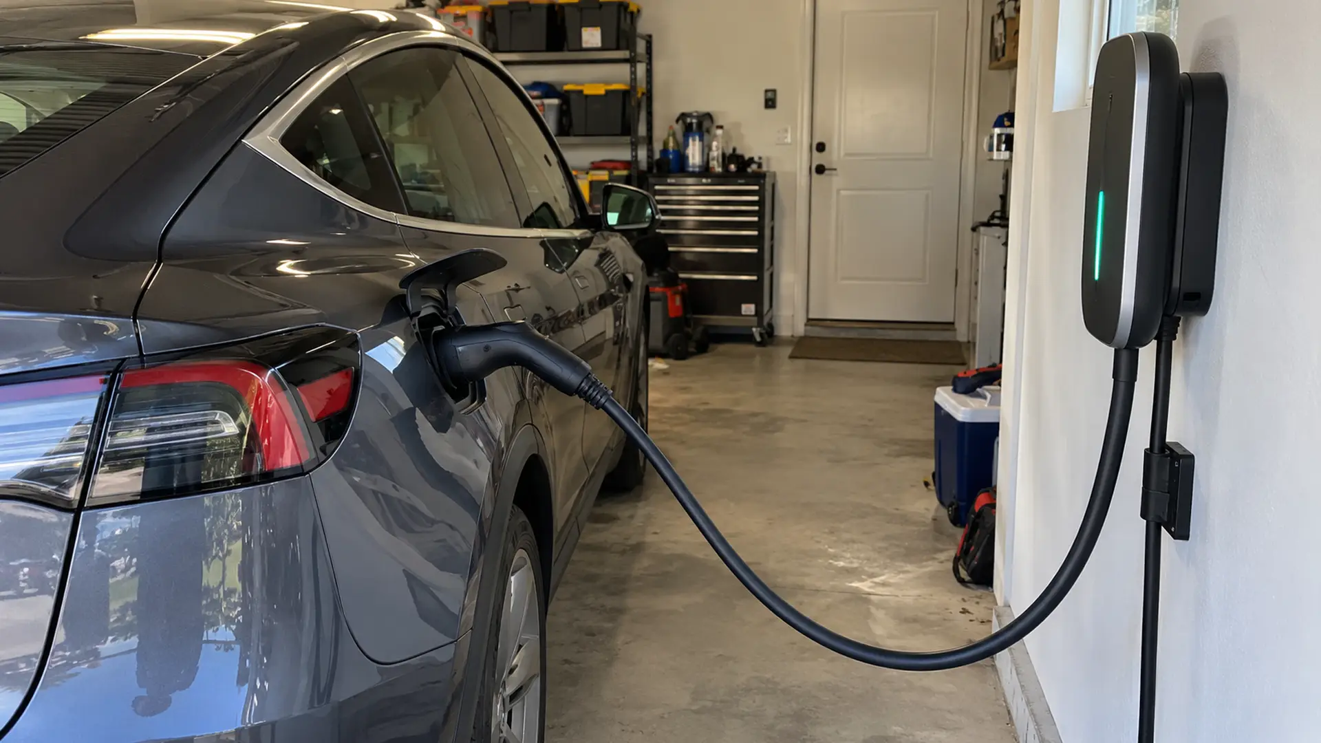 Residential garage EV charger connected to a vehicle